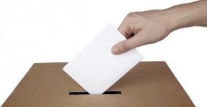 close up of hand and voting ballot